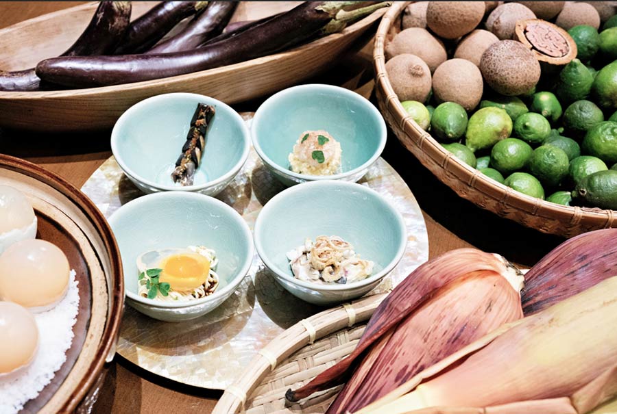 Show of Snacks Clockwise from bottom left - Golden Crystal Egg, Smoked Eggplant, Ukoy and Malasugui Kinilaw, Banana Heart Salad