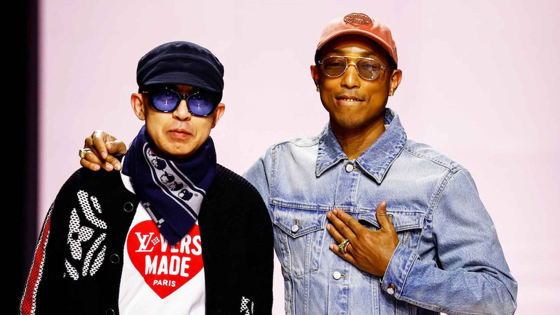 Designer and musician Pharrell Williams walks with Nigo, artistic designer for Kenzo, with who co-creates a collection, walk during a collection show as part of Menswear Fall/Winter 2025-2026 for fashion house Louis Vuitton during Men’s Fashion Week in Paris, France.