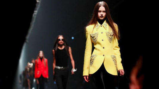 Models present creations from the Versace Fall/Winter 2025/2026 collection during Fashion Week in Milan, Italy.