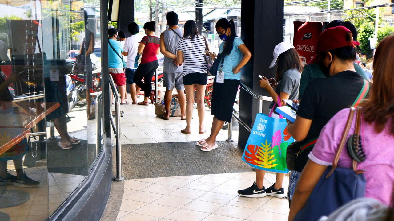 Long queues such as this one are not unusual outside old government buildings.